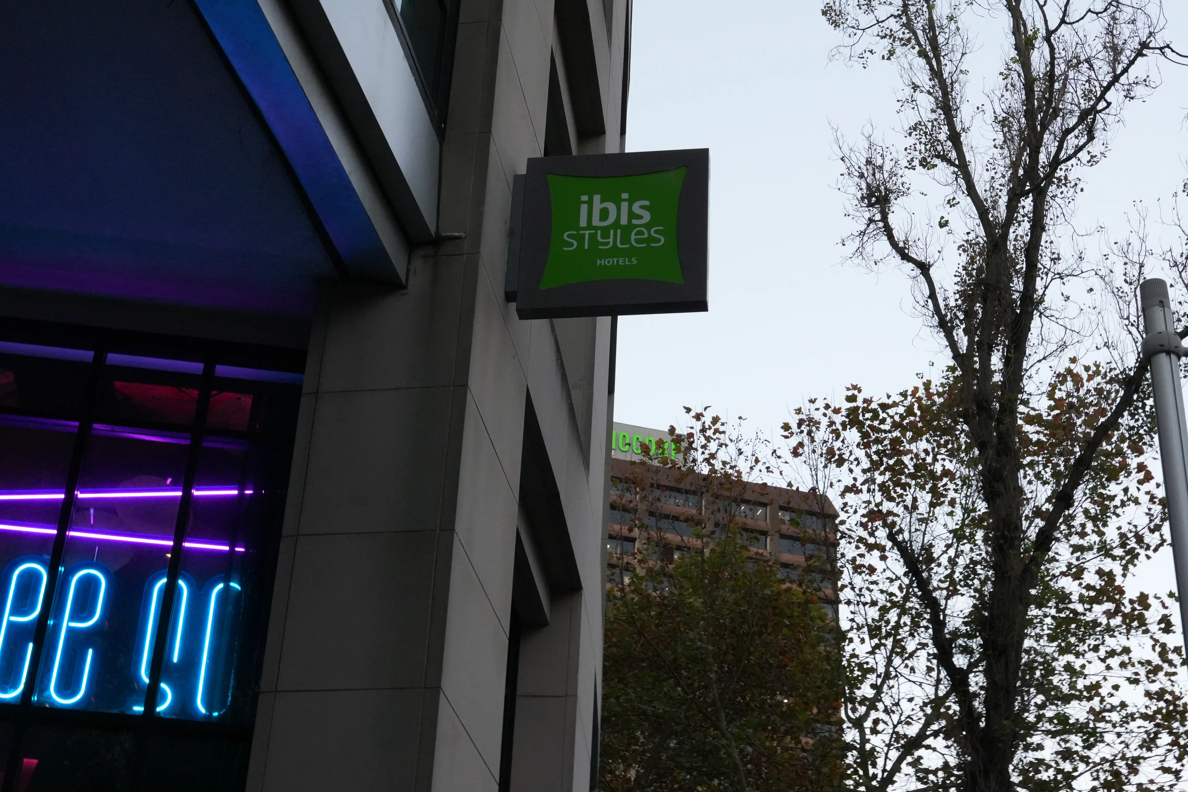 Ibis hotel exterior with illuminated signage