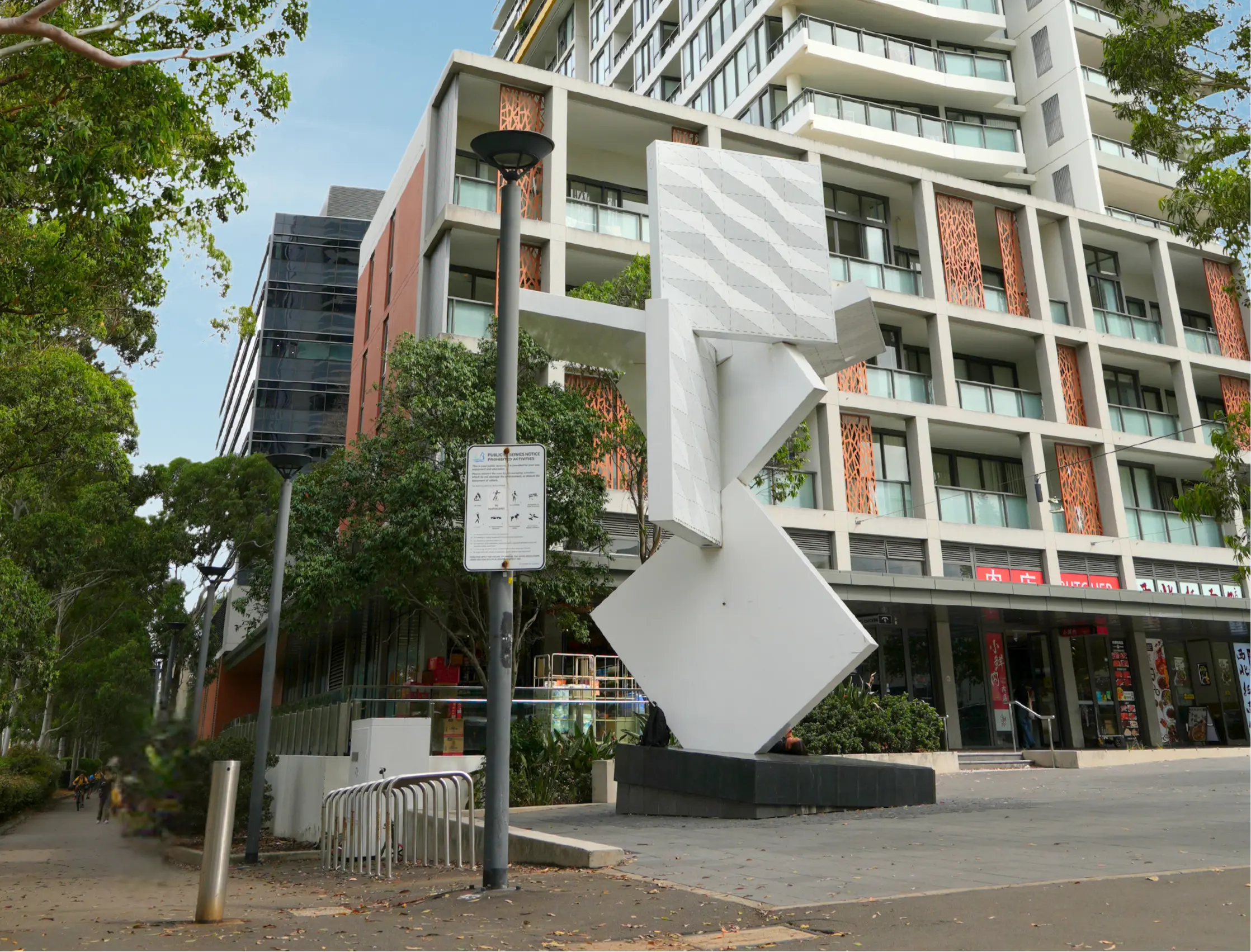 Pinnacle Apartments exterior and sculpture